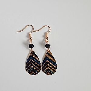 Handmade Gold earring with black and blue chevron pattern